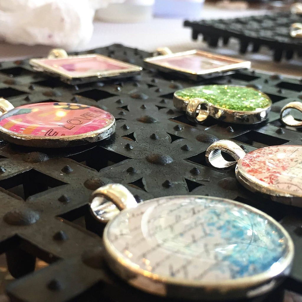 Doming resin in pendants