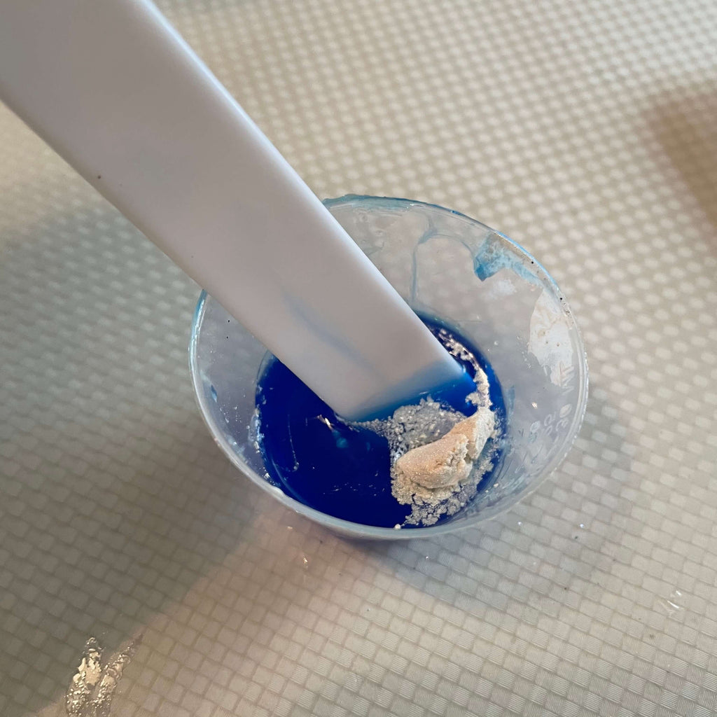 Mixing resin with a stir stick